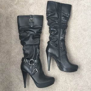 Black high heeled boots by Guess